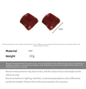 Detail view of wine red geometric square stud earrings with gold copper edges and weight info