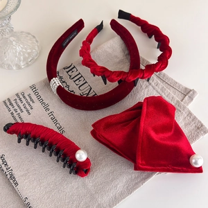 Close-up of luxury red velvet hairband set with pearls and rhinestones decoration