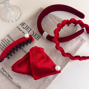 Elegant 4-piece red velvet hair accessory set with pearls and rhinestones on a table