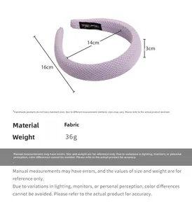 Detail view of purple fabric headband with dimensions 16x14x3cm and handmade label
