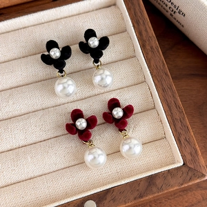 Elegant red and black velvet flower pearl earrings in a vintage French style jewelry box