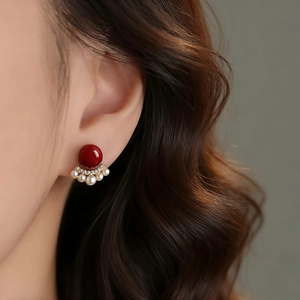 Elegant red bean pearl earrings with fan-shaped gold base and sparkling rhinestones