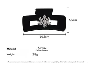 Detailed view of black velvet hair claw clip with rhinestone snowflake, 10.5cm length