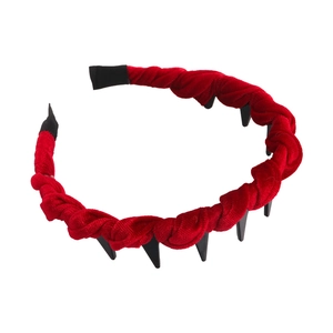 Detail view of a red velvet twisted headband featuring non-slip black inner teeth grips