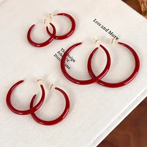 Red enamel horn earrings set in three sizes with gold pins and premium finish