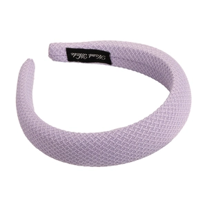 Elegant lavender wide headband with textured fabric and handmade label on white background