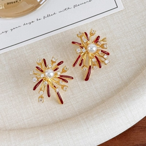Detail of fireworks stud earrings with red enamel, pearls and sparkling zircons