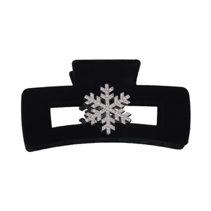Elegant black velvet hair claw with sparkling rhinestone snowflake for winter hairstyle
