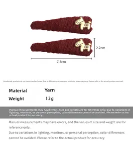 Detailed size specifications of the burgundy knit hair clips with golden pony decor