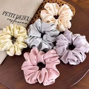 Set of 5 large satin hair scrunchies in pastel colors with silky texture and elegant shine