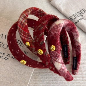 Set of four red plaid and wool headbands with gold button detail and handmade labels