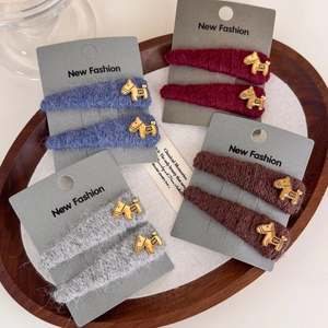 Knitted plush hair clips with gold pony accents in red, blue, grey, and coffee colors