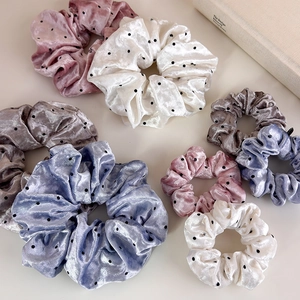 Polka dot velvet scrunchies in multiple colors and sizes for women's hair styling