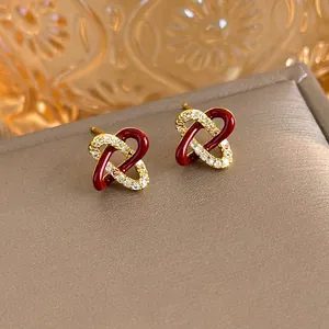 Elegant gold double heart stud earrings with red enamel and white zircon stones