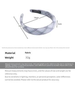 Detail view of grey plaid fabric headband with dimensions and handmade textile label