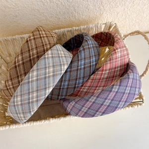 5-piece set of plaid sponge headbands in various colors placed in a white basket