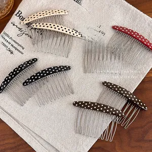 Retro polka dot hair comb clips in four colors on a textured vintage fabric background