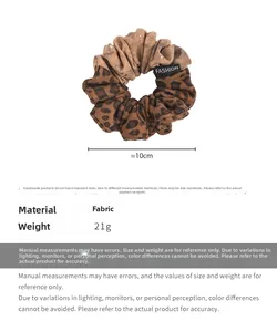 Detail view of leopard print star hair scrunchie with dimensions and fabric texture