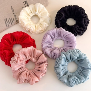 Set of six colorful organza scrunchies in cream, red, purple, and blue silk texture