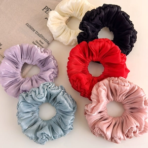 Set of six organza satin scrunchies in pastel colors with elegant pleated texture