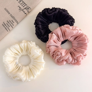 Three-piece pleated organza scrunchies set in cream, black, and pink colors