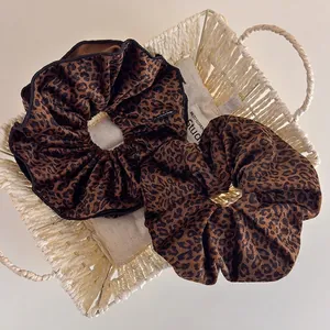 Set of two large leopard print velvet hair scrunchies with elastic design for women