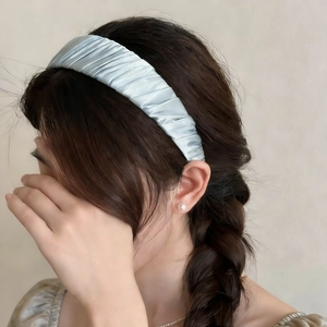 Elegant light blue pleated satin headband for women with a glossy finish and wide brim style