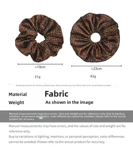 Detailed comparison of two velvet leopard print scrunchies showing sizes 19cm and 23cm