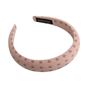 Floral print padded sponge headband in dusty pink fabric with handmade label