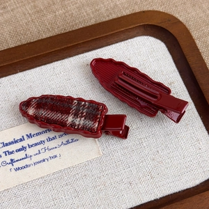 Pair of red cherry hair clips featuring red plaid fabric and glossy wavy duckbill design