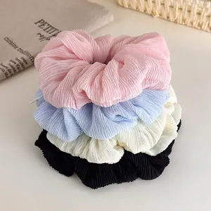 Pleated elastic hair scrunchies set in pink, blue, white, and black colors for girls