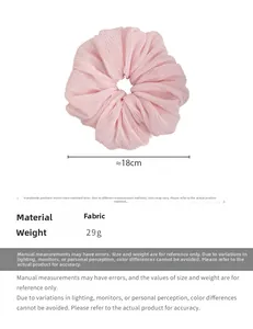 Pink oversized pleated fabric scrunchie detail with 18cm diameter and 29g weight info
