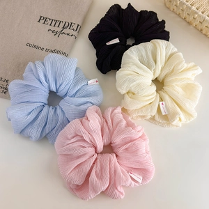 Set of four cream pleated scrunchies with heart handmade tags in pastel colors