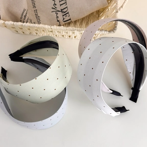 Chic polka dot wide headbands for women in soft pastel colors with non-slip inner grip