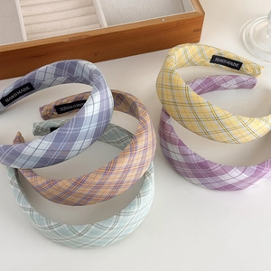 Retro cream plaid padded headbands in yellow, blue, green, and purple plaid patterns
