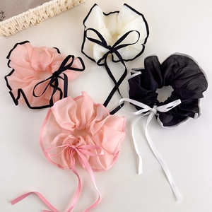 Elegant set of four mesh bow scrunchies with long ribbons in multiple pastel colors
