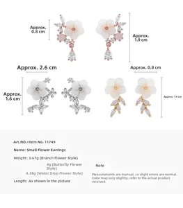 Detailed view of shell flower stud earrings set with zircon accents and measurements