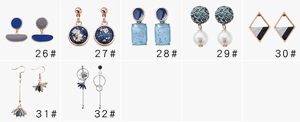 Multiple styles of Morandi blue and grey geometric earrings featuring resin and gold details