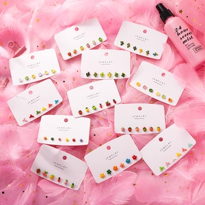 Close-up of a 6-piece cute colorful floral and fruit stud earring set on display card