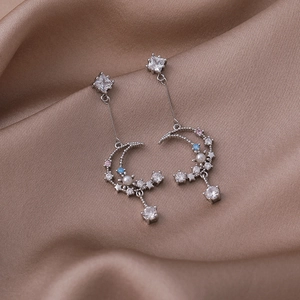 Elegant silver star and moon tassel earrings with colorful zircon stones on silk
