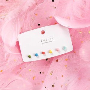 Close-up of a 6-piece geometric earring set with colorful shapes on a jewelry card