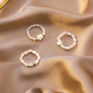 Elegant beaded ring set with mother of pearl shell heart and flower charms for women