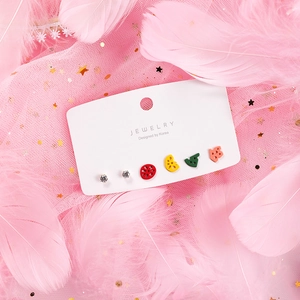 Close-up of 6-piece cute colorful geometric stud earrings set on jewelry card