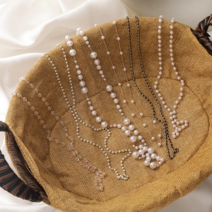 Elegant assortment of pearl and crystal beaded glasses chains and necklaces in a basket