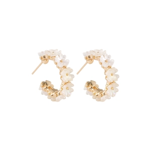 Elegant C-shaped gold-tone hoop earrings with white shell flower inlay and pearly finish
