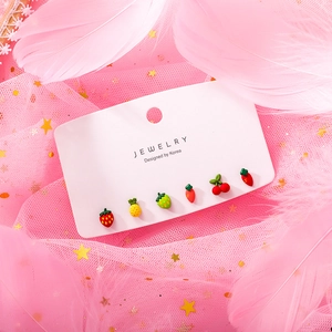 Close-up of 6-piece cute fruit stud earring set featuring strawberry and pineapple designs