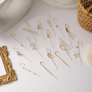 Detailed collection of assorted gold-plated ear cuffs with zircon and pearl accents