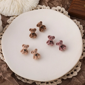 Three pairs of cute flocked teddy bear stud earrings in brown, pink, and white colors