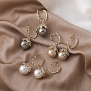 Three-piece pearl earring set with crystal U-shaped buckles in gold, grey and white