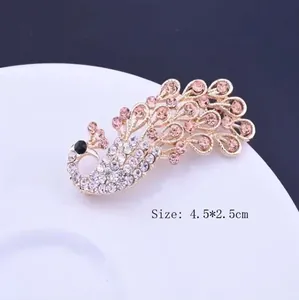 Elegant peacock brooch pin with pink rhinestones in gold alloy finish, 4.5 by 2.5 cm size